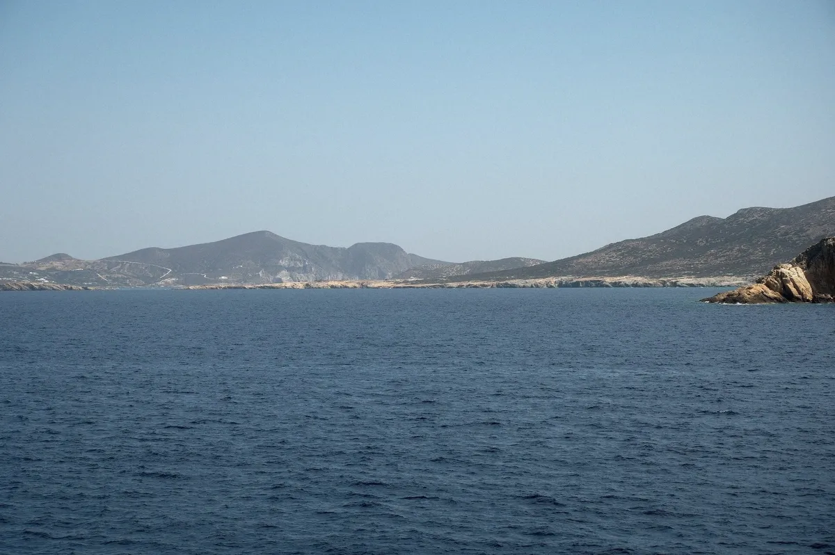 Rocky shoreline of Despotiko islet off Antiparos on a kaiki cruise from Paros