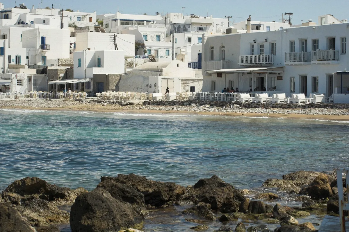 Harbour side of Naoussa town in Paros with boats on quiet water