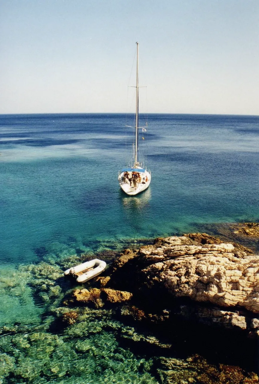 The rocky coast of Paros island from the water on a catamaran cruise