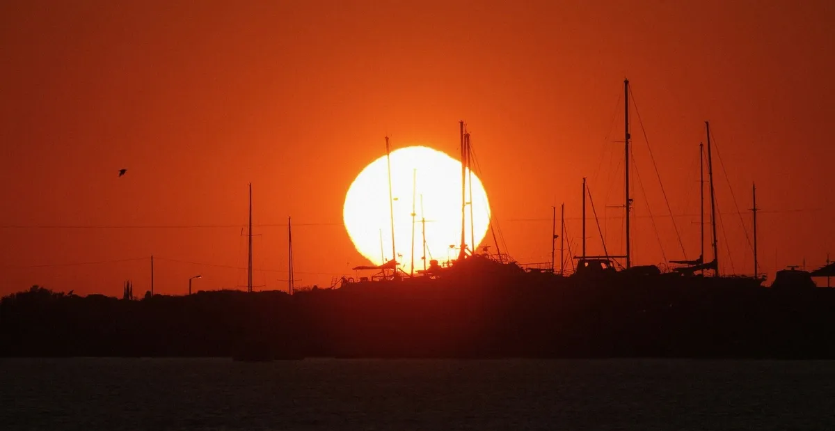 Warm sunset colours over the sea at Paros on a golden-hour cruise